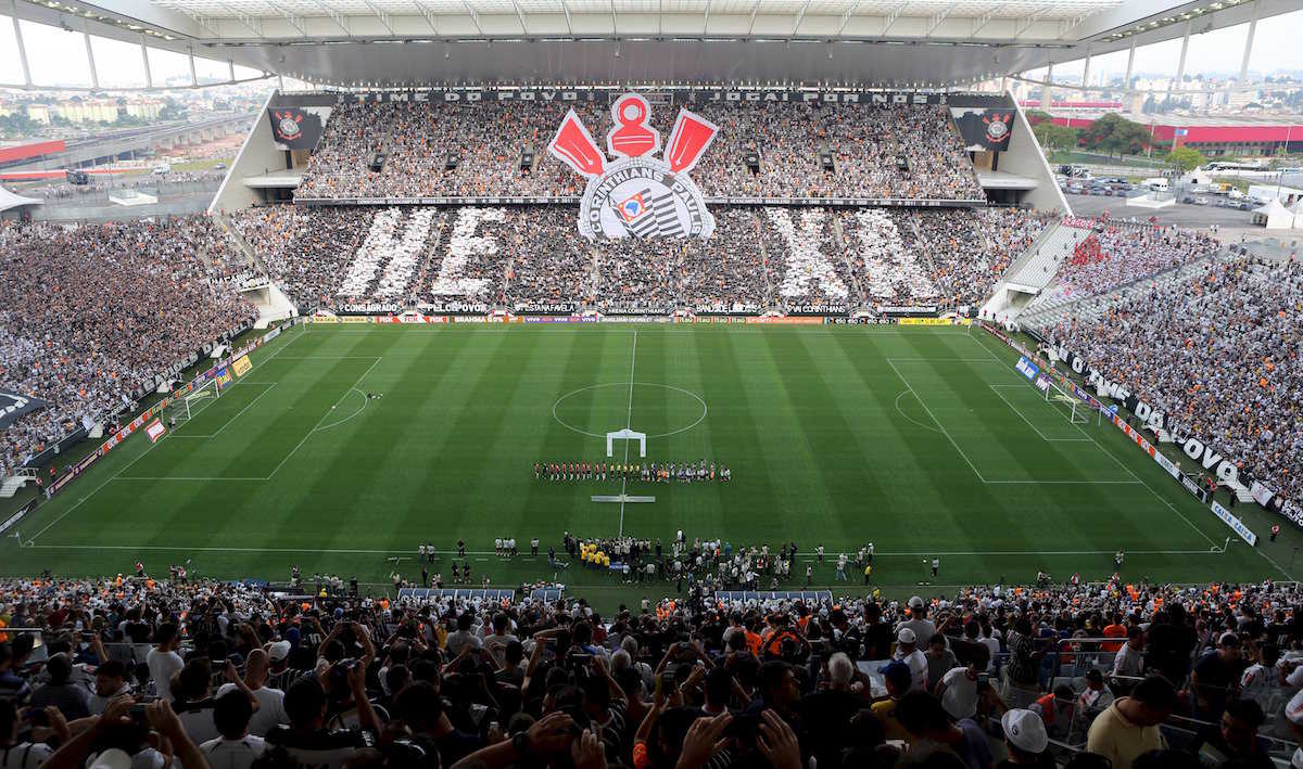 Fans of Corinthians cheer for their team before their Brazil Serie A soccer match against Sao Paulo, at Arena Corinthians stadium, which was built by Odebrecht SA, in Sao Paulo, in this November 22, 2015 file photo. REUTERS/Paulo Whitaker/Files